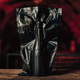 Bottle of wine in black vacuum-sealed packaging with red cave background